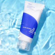 Tube of hyaluronic acid moisturizing cream on a blue water background