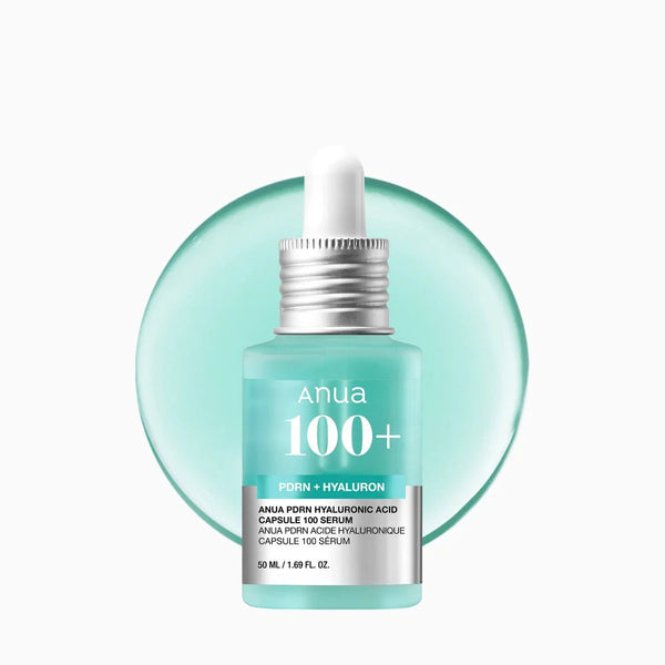 Skincare serum bottle with dropper labeled 'Anua 100+' on a light green background