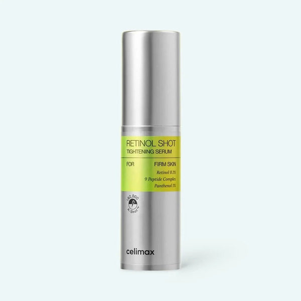 Skincare serum bottle with green label on a white background