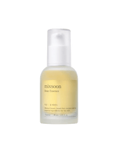 Bottle of mixsoon Bean Essence on a green background