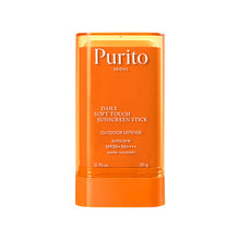 Orange sunscreen stick with 'Purito' branding on a white background