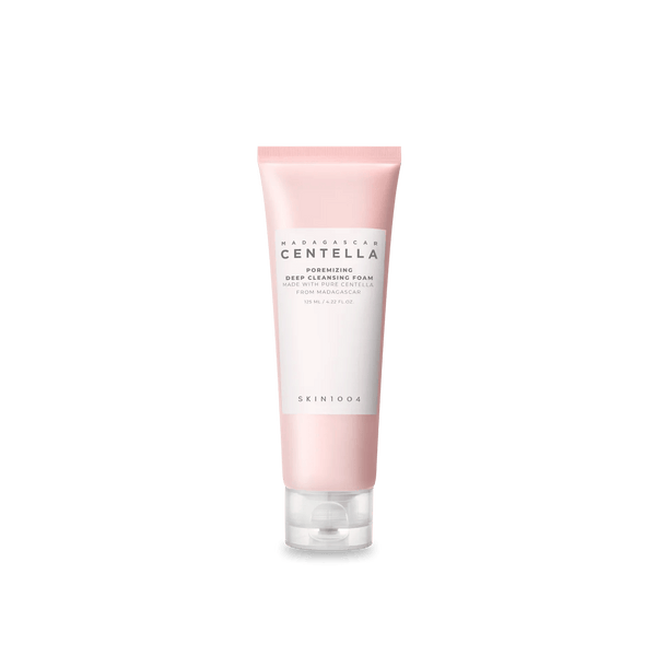 Skincare tube with pink and white design on a white background