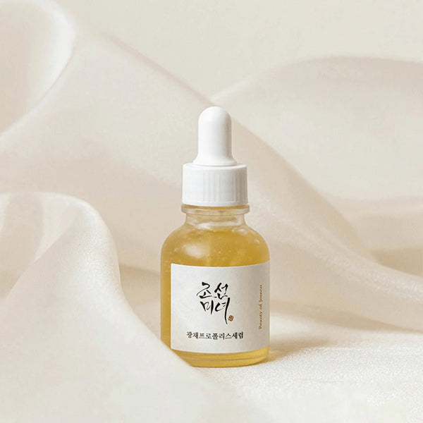 beauty of joseon glow serum serum bottle with dropper on a soft beige background