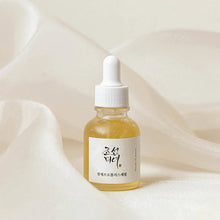 beauty of joseon glow serum serum bottle with dropper on a soft beige background