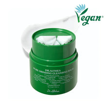 Green jar of Dr. Althea Pure Grinding Cleansing Balm with cotton pads on a white background, featuring a Vegan label.