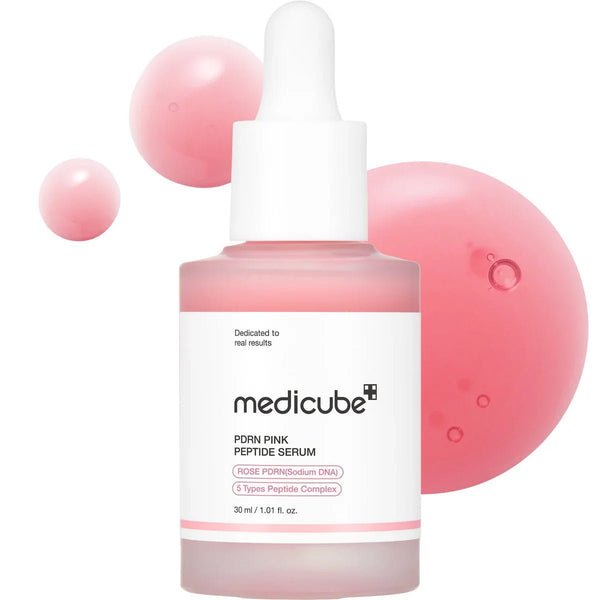 Medicube PDN Pink Peptide Serum bottle with pink bubbles on a white background